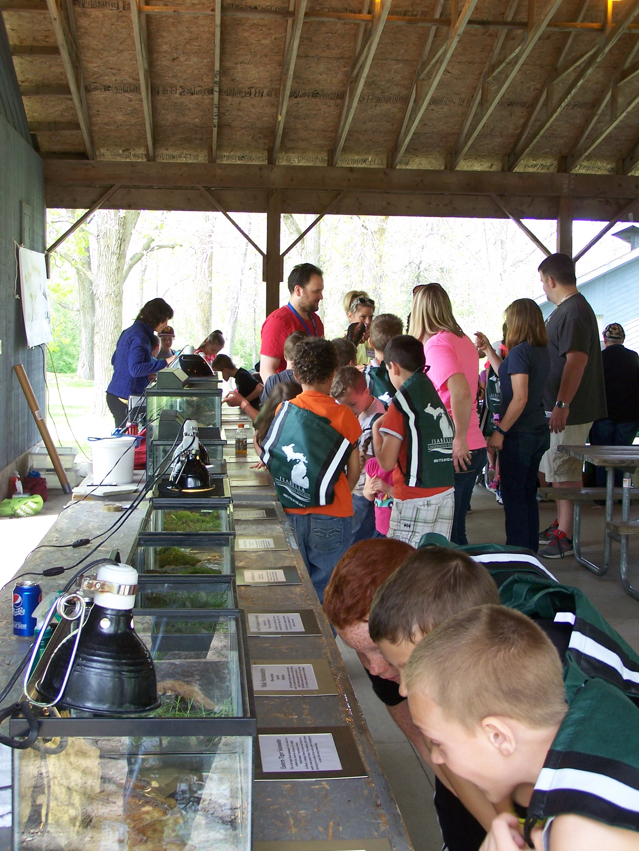 People looking at tanks